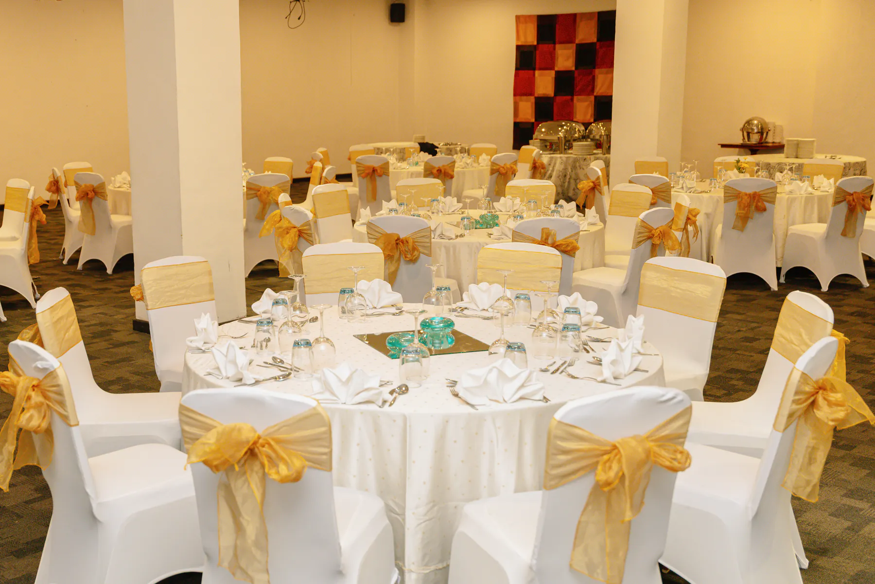 Round tables with gold chair sashes