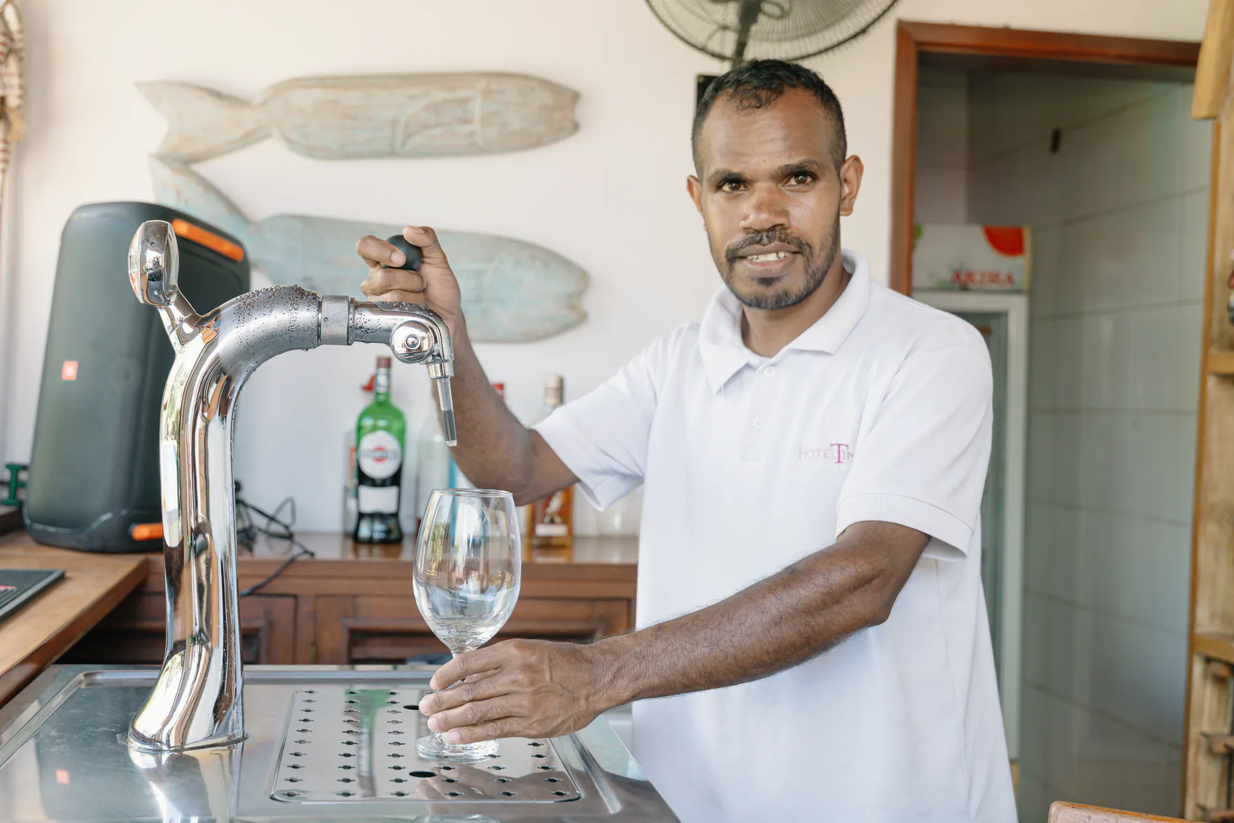 A drink being poured at the Pool Bar