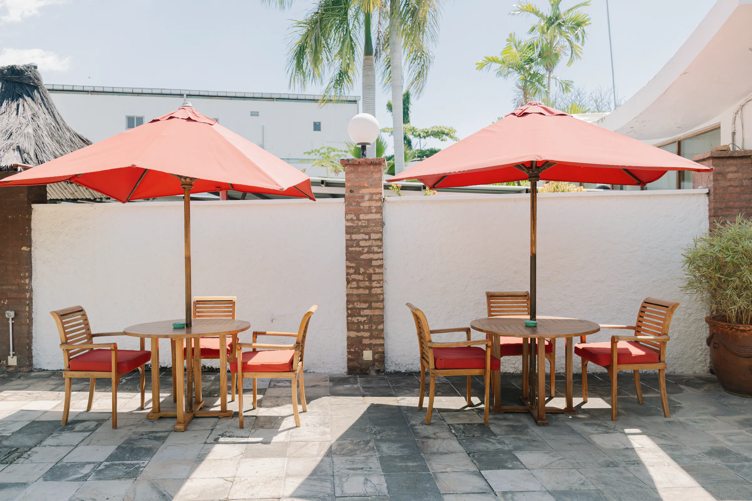Shaded tables and parasols on the pool terrace